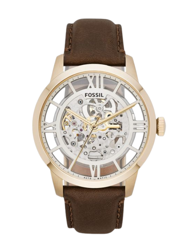 A Fossil skeleton automatic watch with a gold-toned case, exposed mechanical movement, Roman numeral hour markers, and a brown leather strap