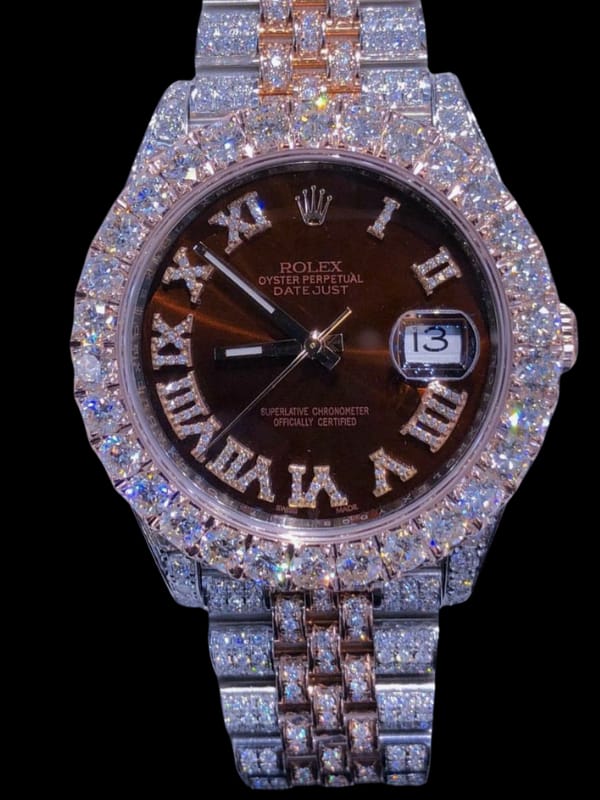 luxurious Rolex Datejust watch featuring a brown dial, Roman numeral markers, and a fully diamond-encrusted bezel and bracelet,