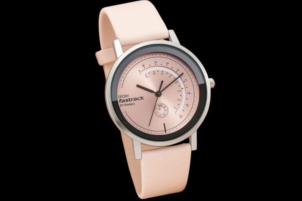 A stylish pink Fastrack sport watch with a round dial, modern index design, and matching silicone strap