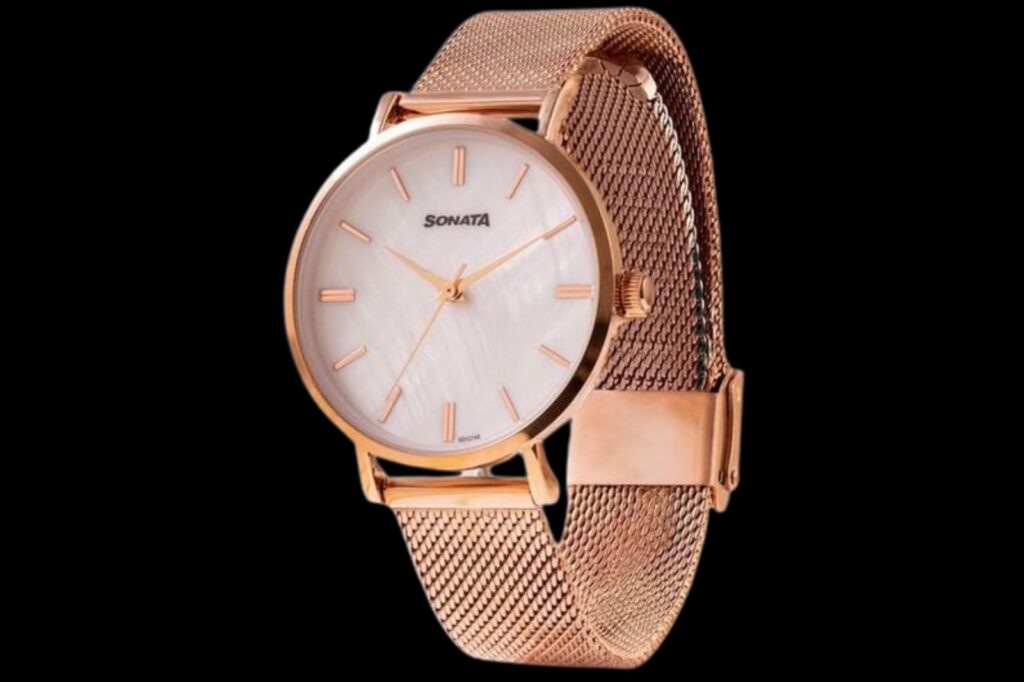 A rose-gold Sonata wristwatch with a white dial and a mesh metal strap